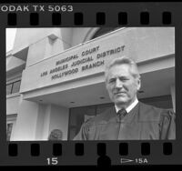 Judge Harold Crowder standing at entrance of Hollywood Branch of Los Angeles Municipal Court, Calif., 1986