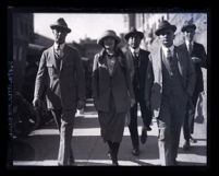 Clara Phillips with A. L. Phillips and another man in a courtroom, Los Angeles, 1922-1923