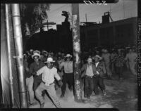 Rioting crowds of Mexican workers cross the U.S.-Mexico Border, Mexicali (Mexico)