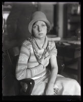 Eunice Pringle showing an abrasion on her arm received when attacked by Alexander Pantages, Los Angeles, 1929