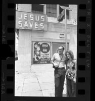 Arnold Dietrich, leader of Los Angeles Children of God, with his wife Faith Berg, in front of the sect's Skid Row building, 1970