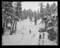 Children playing on snow covered Kratka Ridge in the Angeles National Forest, Calif., 1963