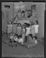 Ella W. Duffield playing piano and singing with nursery children, Los Angeles, 1935