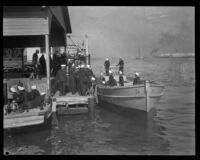 Sailors unloading a trunk at the Banning Lumber Wharf in San Pedro during a visit by Hervert Hoover, Los Angeles, circa 1929-1934