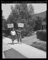 Carmen Lugano and Rosemary Rodriquez picket home of owner of a Glendale plastics company, 1951