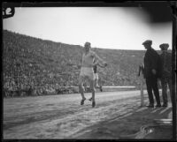 Paavo Nurmi crosses the finish line at the Coliseum, Los Angeles, 1925