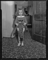 Evelyn Asther, daughter of Vivian Duncan, holding a stuffed animal, Los Angeles, 1935