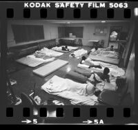 Youths sleeping on mattresses on the floor at Central Juvenile Hall in Los Angeles, Calif., 1983