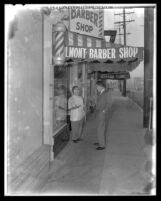 Richard Nixon on an early-morning stroll, chatting with barbershop owner in Los Angeles, Calif., 1958