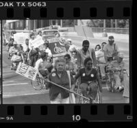 Physically disabled protestors demonstrating for mandating chairlifts on transit buses in Los Angeles, Calif., 1985