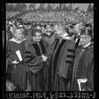 Mexico's President Lopez Mateos shaking hands with Lyndon Johnson at UCLA commencement, 1964