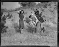 Golfer John Revolta with score keeper Virginia Verrill at the Los Angeles Open tournament in Griffith Park, Los Angeles, 1939