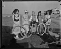 Newport Beach water parade, young women on Long Beach Chamber of Commerce float representing 1932 Olympics, Newport Beach, 1932