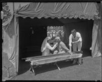 Red cross workers administering first aid in tent during the funeral of Will Rogers at Forest Lawn, Glendale, 1935