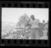 Magic Johnson joking with crowd at Lakers World Championship rally in Los Angeles, Calif., 1985