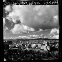 Cityscape of Los Angeles seen from Fifield Plaza on Wilshire Blvd. looking northwest toward Santa Monica Mountains, 1965