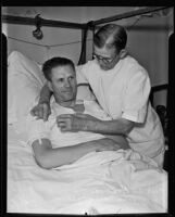 Nurse John Herboltzheimer treating Police Officer S. J. Anderson, Los Angeles, 1935