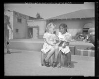 Margaret Loomis greeting children brought to L.A. for vacation by American Friends' Services, 1948