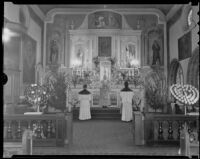 Father M. Thomas officiates at high mass at the Church of Nuestra Senora La Reina de Los Angeles in honor of Harry Carr, columnist, Los Angeles, 1936