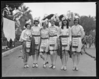 Six young women who hold the banner announcing the start of the Tournament of Roses Parade, Pasadena, 1928