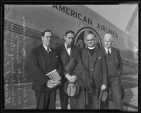 Rabbi Edgar F. Magnin, Bishop Bertrand Stevens, Thomas S. Evans, and Reverend Everett Clinchy pose in front of an airplane, Los Angeles, 1935