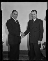 Judges Clarence L. Kincaid and Frank M. Smith shaking hands, Los Angeles, 1933-1939