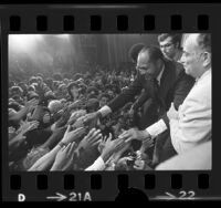 Mayor-elect Tom Bradley shaking hands with supporters at mayoral victory celebration in Los Angeles, Calif., 1973