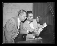 District Attorney J. Miller Leavy questions Officer Sam Sirianni during the Monahan murder trial, Los Angeles, 1953