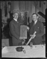 Senator William G. McAdoo presents a plaque and scroll to flyer Col. Roscoe Turner at the Biltmore, Los Angeles, 1933