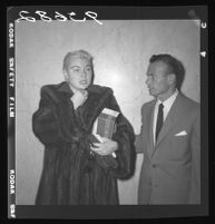 Barbara Payton (with Attorney Milton Golden) receives a delay in check-fraud case due to illness, Los Angeles, 1955