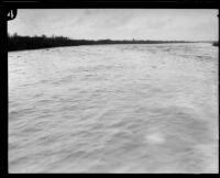 Los Angeles River flooded by torrential rain seen from the Compton Bridge, Compton, 1927