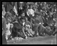 Spectators steated along the route of the Tournament of Roses Parade, Pasadena, 1932