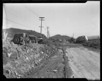 Boulder deposited in the middle of Foothill Boulevard by a catastrophic flood and mudslide, La Crescenta-Montrose, 1934