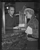 Eva Bostch collecting Bank of America Christmas Club check, Los Angeles, 1935