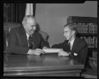 James Holden presenting Judge Thomas White with a list of his wants, Los Angeles, 1935