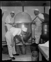 Cooks in the Los Angeles County General Hospital kitchen attend to a vat of cooking liquid, Los Angeles, [1934]