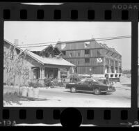 Construction of apartment house next door to Craftsmen style home in Venice, Calif., 1973