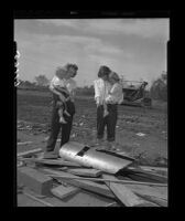 Mrs. William and Richard Houle and their children look at pieces of the pipe in which Kathy Fiscus had been trapped, 1949