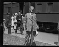 Dr. Albert Michelson, physicist, arrives at the train station, Pasadena, 1928