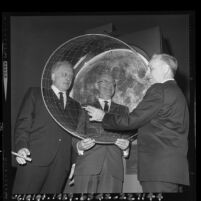 Bart Lytton, Dr. Clair O. Musser and Clarence H. Cleminshaw demonstrating the Musser Copernican Planetarium at Griffith Observatory, Los Angeles, 1965