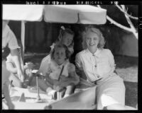 Actress Virginia Bruce, daughter Susan Ann Gilbert, and guest Susan Zanuck at Susan Gilbert's 7th birthday party, [Santa Monica?], 1940