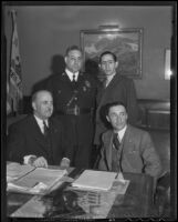 Frank Shaw, Florencio Avila Sanchez, James Davis and Ricardo Hill meet in Shaw's office to discuss a radio broadcast by President Cardenas of Mexico, Los Angeles, 1936