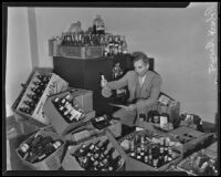 Robert Brown of the liquor control division checks cases of seized liquor in the California State Building, Los Angeles, 1935