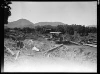 Workmen clearing flood debris following the failure of the Saint Francis Dam and the resulting flood, Santa Clara River Valley (Calif.), 1928