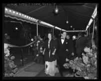 Spencer Tracy and wife, Louise walking the red carpet at motion picture premiere of "Life of Emile Zola" in Los Angeles, Calif., 1937