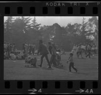 Family arrives at Century Plaza for demonstration against Vietnam War during President Johnson's visit, 1967