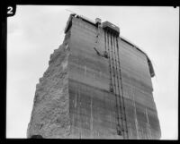 View of the remaining center portion of the St. Francis Dam after its disastrous collapse, San Francisquito Canyon (Calif.), 1928