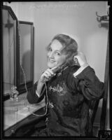 Mary McCormic, opera singer, curls her hair, Los Angeles, 1935