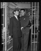 Henry Guttman, convicted on theft charges, being searched by Deputy Jailer Herbert Young, Los Angeles, 1935