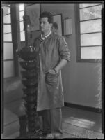 Atanas Katchmakoff, sculptor, with his bronze Madonna sculpture, Los Angeles, 1935